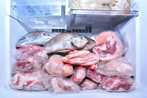 Frozen meat loaded into a freezer van for delivery in Abu Dhabi